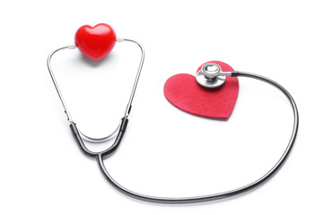 Stethoscope and hearts on white background. Cardiology concept