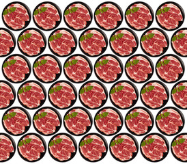 Raw pork neck meat cuts on a plate top view isolated on white background