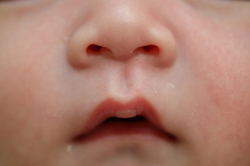 close up mouth and nose of cute newborn baby softness sensitive skin