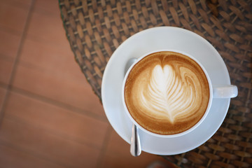 hot latte coffee drink put on table in cafe restaurant