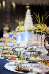 Kitchenware in the line catering buffet food in wedding reception