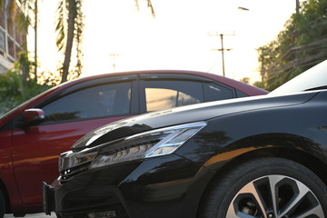 Obraz na płótnie Canvas closeup headlight led of black modern car in the morning scene