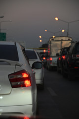Fototapeta na wymiar traffic jam on night road, car driving in rush hour of city life