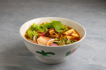 laksa noodle soup with grey background