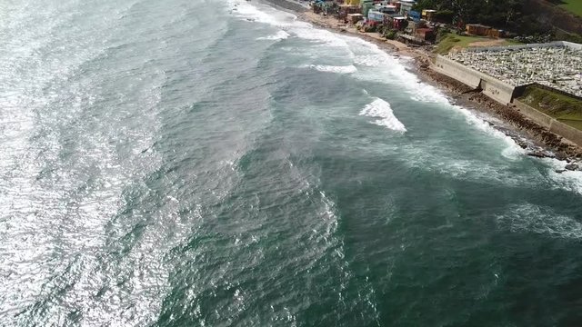 Vibrant Coastline of San Juan City, Puerto Rico, Tilt Up Aerial View on Ocean Waves, Colorful Houses and Skyline