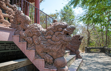 Dragon sculpture on staircase in garden, Vietnam