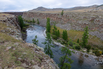 Fototapeta premium Chuluut River Canyon in Mongolia near the Tariat town. A tilt shift photography of this huge canyon in the valley of the Khangai Mountains in central Mongolia. A tributary of the Ider river.