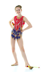 Little girl gymnast in a sports swimsuit.