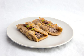 Fried Sorghum pancake with red bean which is called susu bukkumi in Korea