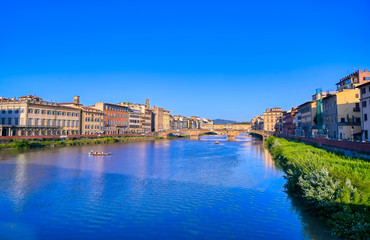 A view of the Arno River towards the Ponte Vecchio in Florence, Italy.