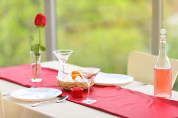 Luxury valentines dinner celebrating anniversary for couple which boyfriend preparing ring on the table for proposing his girlfriend with copy space