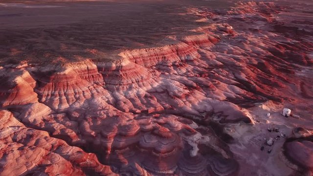 Aerial View of Striped Sandstone Landscape and Mars Desert Research Station in Utah, USA Under Golden Hour Sunlight