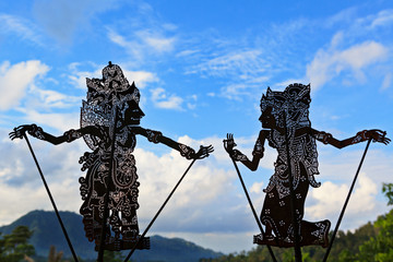 Black shadow silhouette of traditional Balinese puppets Wayang Kulit