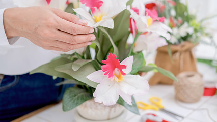 Fototapeta na wymiar Flower shop staff arrange flowers as ordered for valentines.