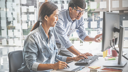 Graphic design and color swatches and pens on a desk. Architectural drawing with work tools and accessories.