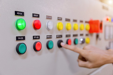 Engineer working on checking and maintenance electrical equipment engineer checking status switchgear with checklist System ready.