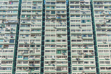 Fototapeta na wymiar Facade of high rise residential building in Hong Kong city