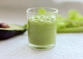 avocado and celery smoothie. weight loss and healthy food concept. vegetarian meal plan. greens in the kitchen. blended green smoothie.