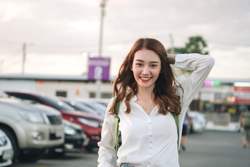 Beautiful asian woman at car park night market. Bangkok, Thailand.