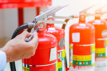 Obraz premium Engineer inspection Fire extinguisher and fire hose.