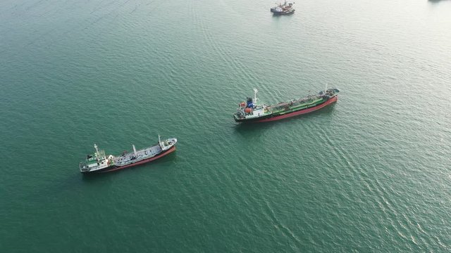 Aerial top view of the ship carrying the lpg and oil tanker in the sea port with vessel logistics. For energy export and import business for transportation trade. footage video 4k B-roll scene.