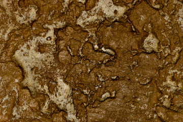 A close-up of an uneven stone wall texture background