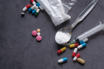 Fototapeta na wymiar top view of drug , herein and pill on table, drug abuse