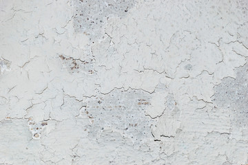 Grungy dirty white wall with cracks texture background