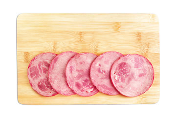 Slices of sliced ham on the kitchen Board. Isolated on a white background.
