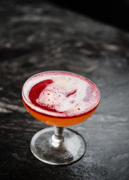 Champagne cocktail with red wine floater