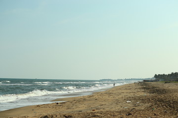 brilliant empty beach against blue sky on sunday