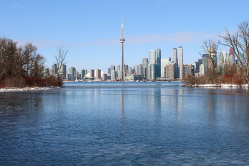 City skyline with frozen lake in winter