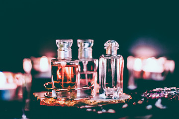 Perfume bottles and vintage fragrance at night, aroma scent, fragrant cosmetics and eau de toilette as luxury beauty brand, holiday fashion parfum design - obrazy, fototapety, plakaty