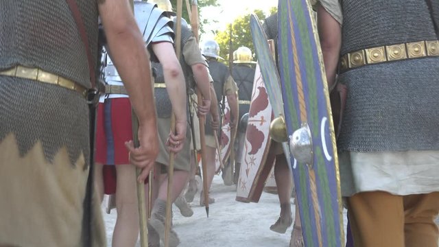 Roman legion military of ancient Rome. Roman military personal equipment. The Roman military cadence. March of soldiers. A reenactors dressed as a Roman soldier