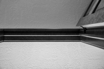 Black and white photo looking up at room transitions