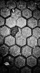 abstract grunge paving stone texture. use as a background or wallpaper. black and white, so contrast and grainy.