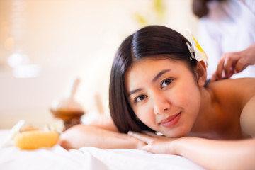 Obraz na płótnie Canvas Asian Beautiful, young and healthy woman in spa salon. Massage treatment spa room . Traditional medicine and healing concept.