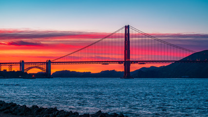 Fiery sunset backdrop behind the Golden Gate Bridge