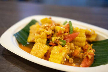 Spicy fruits salad mixed with corn and tomato