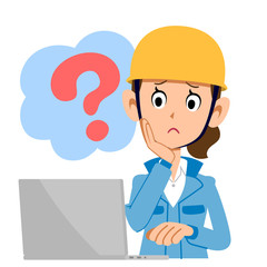 疑問を持ってパソコンを操作する建設業の女性　青い服