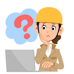 疑問を持ってパソコンを操作する建設業の女性　ベージュの服