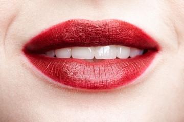 Fototapeta premium Closeup macro portrait of female red smiling lips with day beauty makeup.