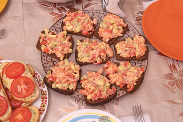 Sandwich with tomatoes with salmon avocado brown bread