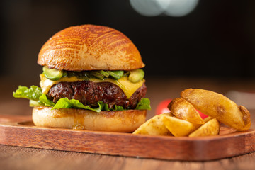 Fresh home-made hamburger served on wood