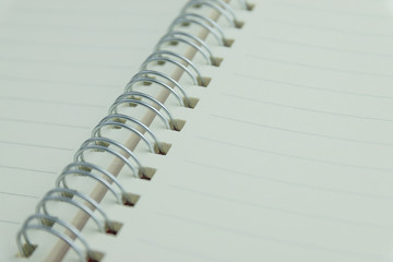 The notebook has lines placed on a white scene.