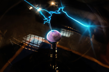 Plasma sphere static electricity line science. Hand touching plasma globe with plasma ray physics.