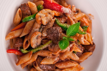 beef Alfredo pasta in plate