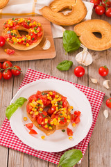 Friselle with tomatoes and mais.