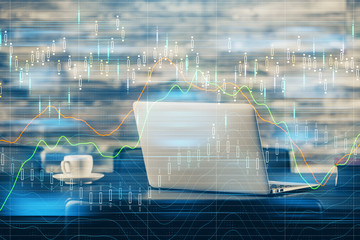 Financial graph colorful drawing and table with computer on background. Double exposure. Concept of international markets.