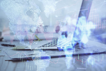 Forex market chart hologram and personal computer background. Double exposure. Concept of investment.